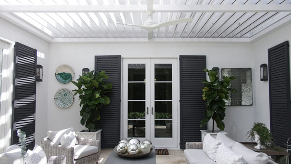 Cozy pergola space with white outdoor furniture