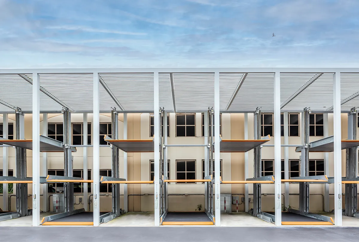 Elegant multi-level parking structure with premium aluminum canopy and upscale design by SYZYGY Global.
