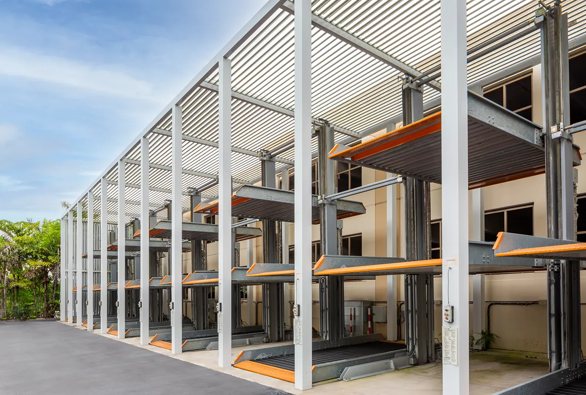 ): Innovative multi-level parking structure with shaded aluminum canopy and precision lift system by SYZYGY Global.