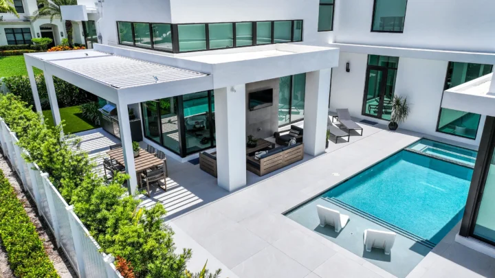 Aerial view of a luxury outdoor living space with modern pergola