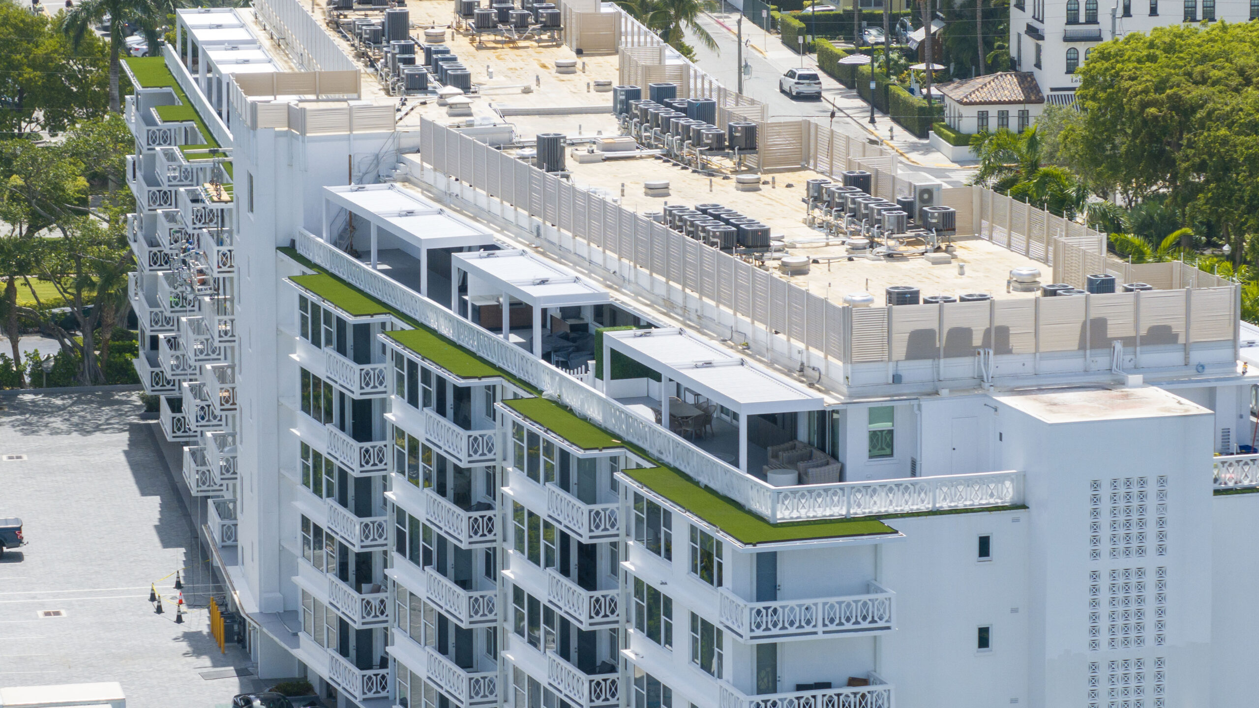  Aerial view of Royal Poinciana apartment complex in Palm Beach featuring new R-Blade pergolas on each penthouse.