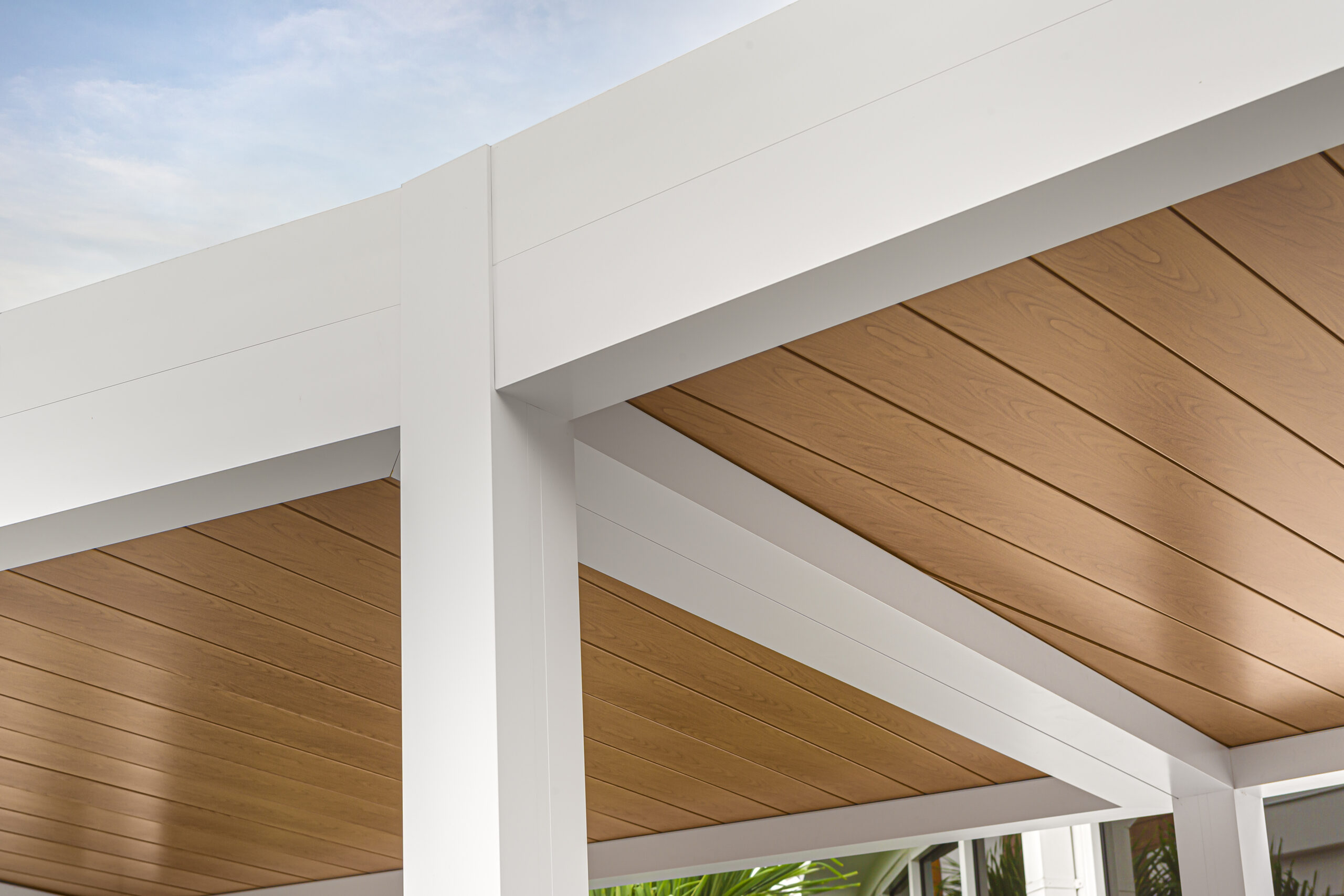 Close-up of wood grain aluminum pergola ceiling panels at The Club at Admiral’s Cove, showcasing clean lines and craftsmanship.