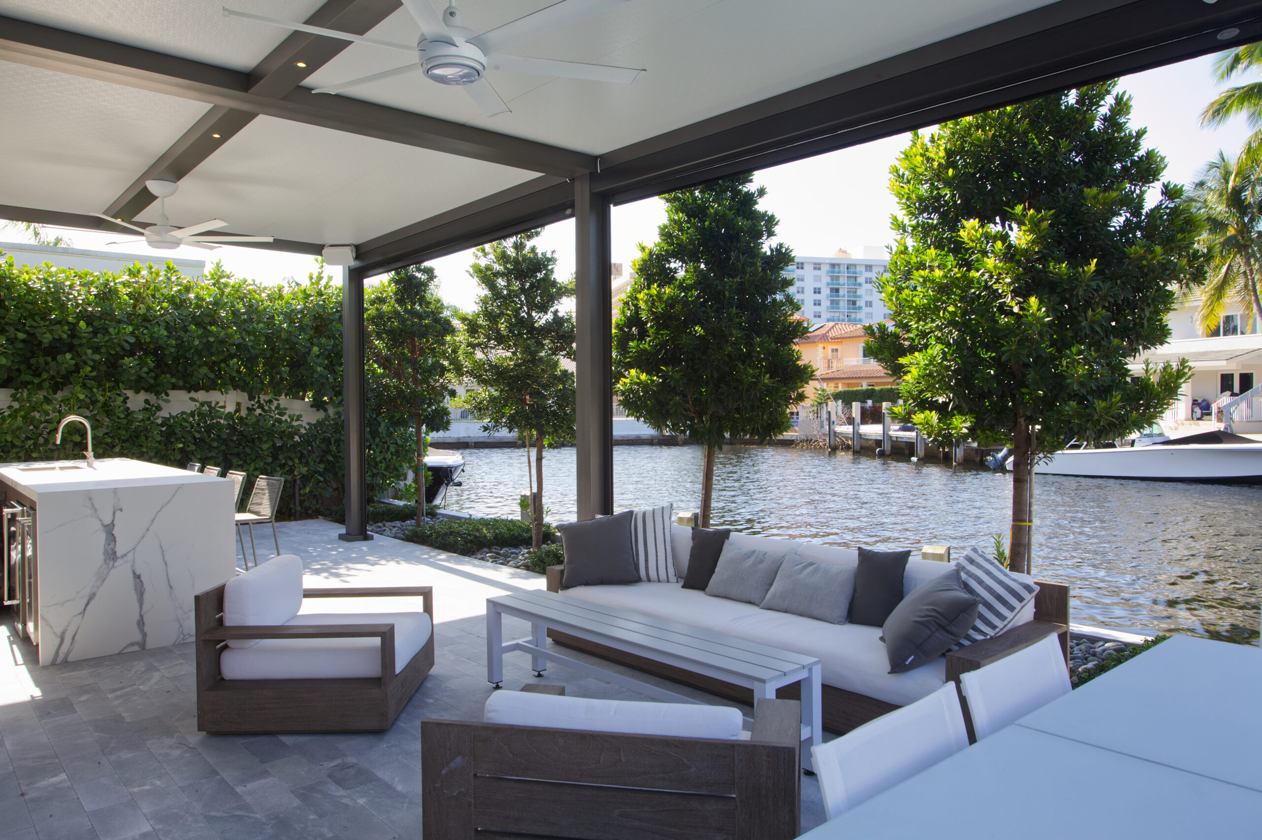 Motorized louvered pergola with integrated lighting and seamless architectural integration.