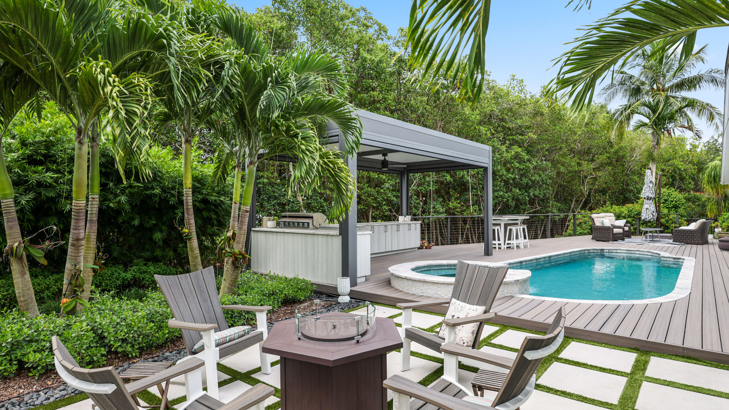 Custom luxury pergola in South Florida with pool, spa, and modern outdoor entertaining area.