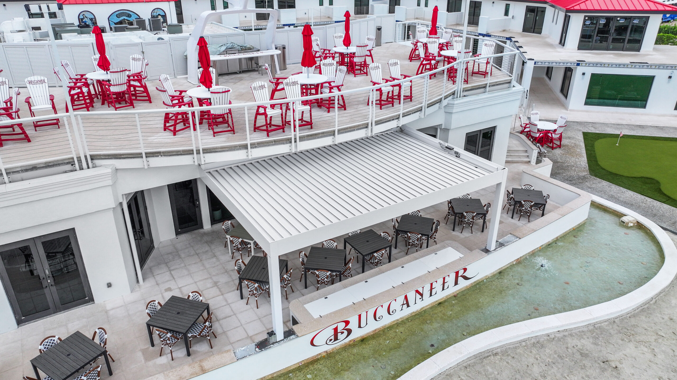 Waterfront restaurant patio cover with modern aluminum pergola and outdoor dining area.